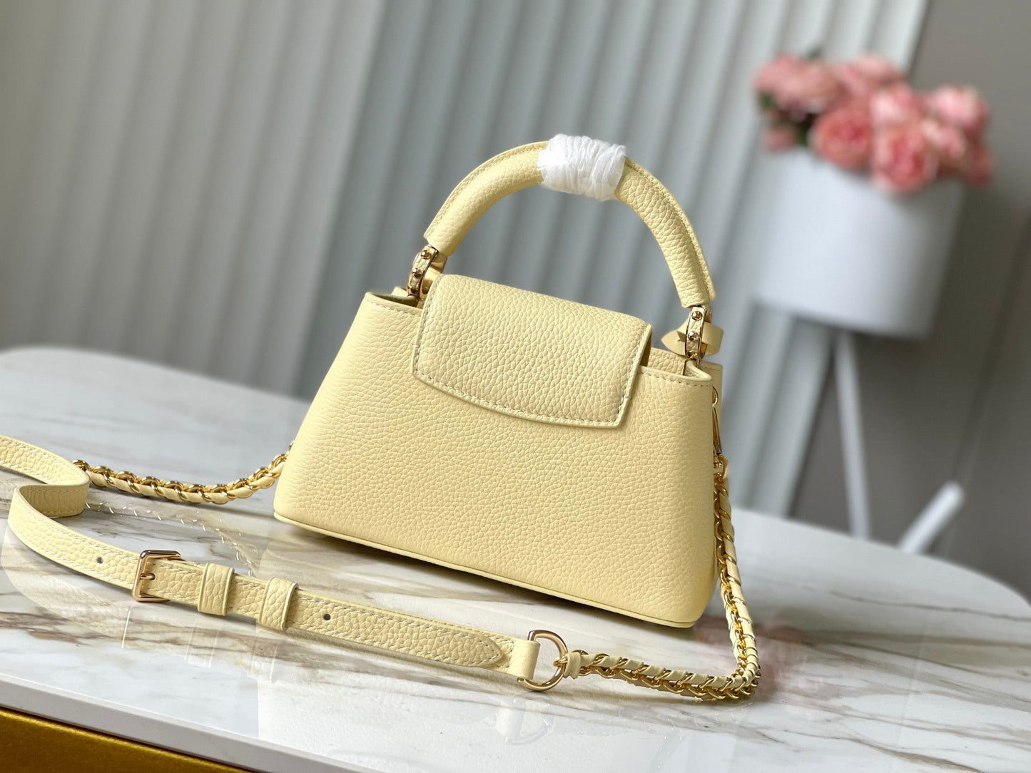 CAPUCINES EAST-WEST MINI 22 IN BANANA YELLOW TAURILLON GOLD HARDWARE