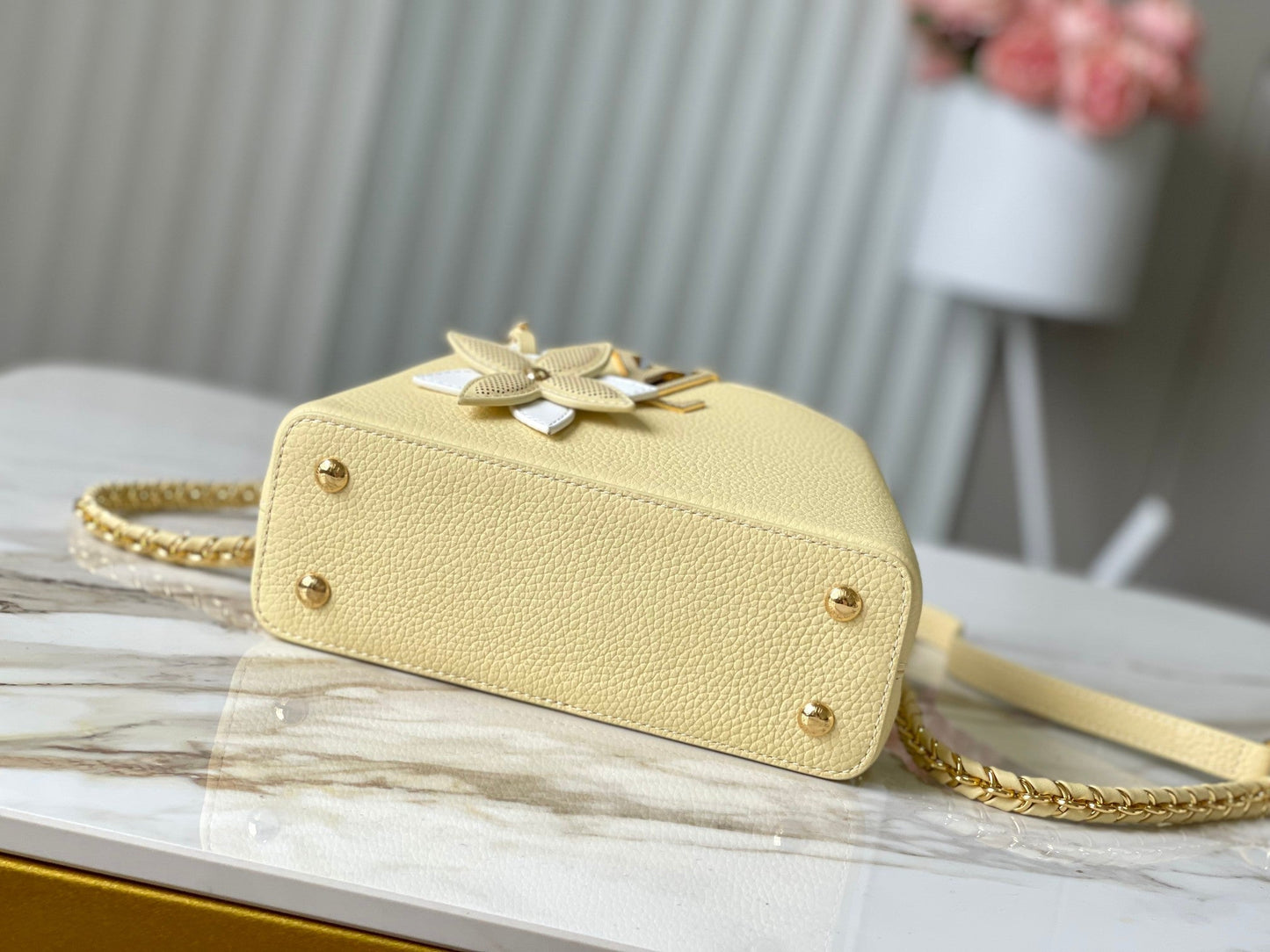 CAPUCINES EAST-WEST MINI 22 IN BANANA YELLOW TAURILLON GOLD HARDWARE