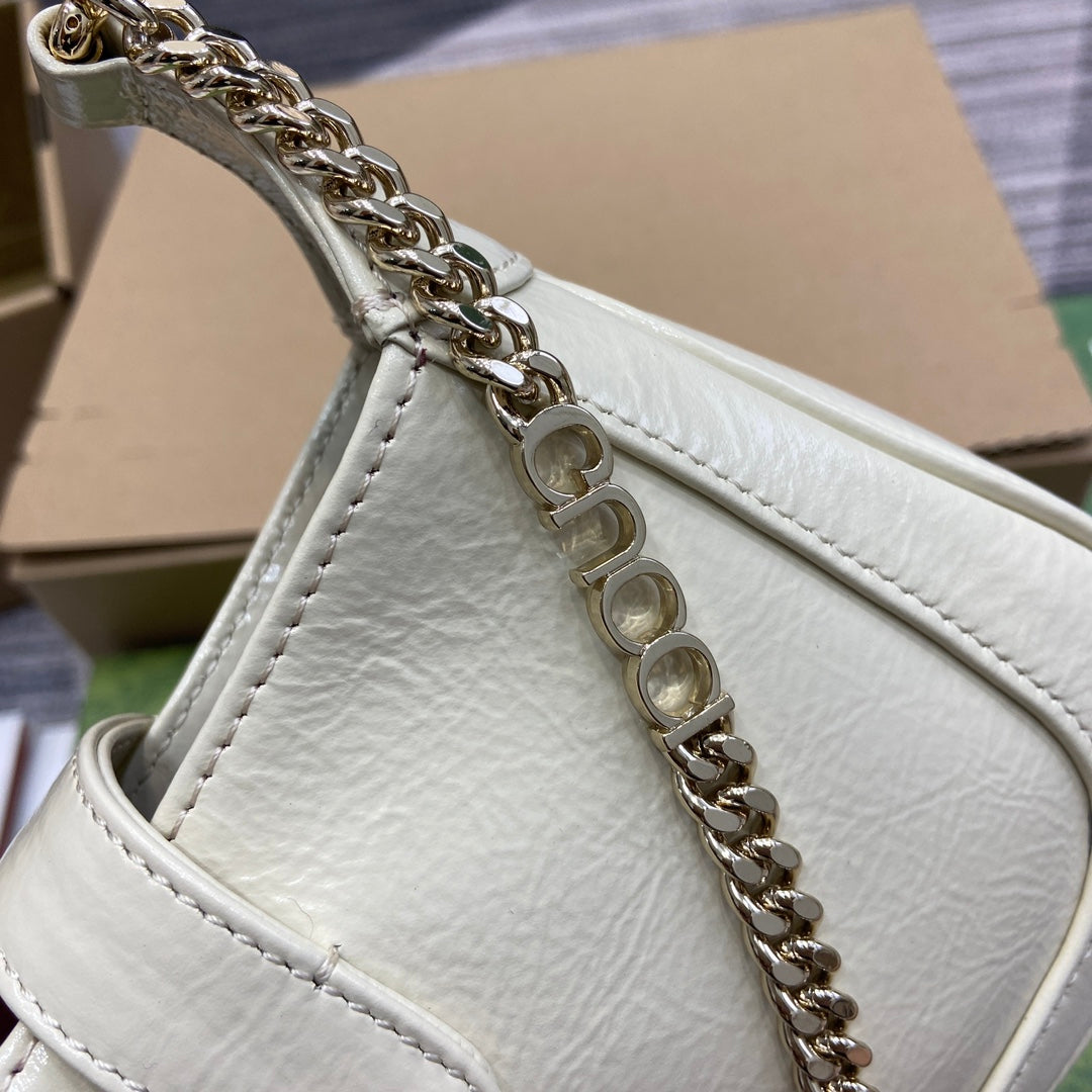 JACKIE NOTTE MINI BAG 19 IN WHITE CRACKED LACQUER CALFSKIN GOLD HARDWARE