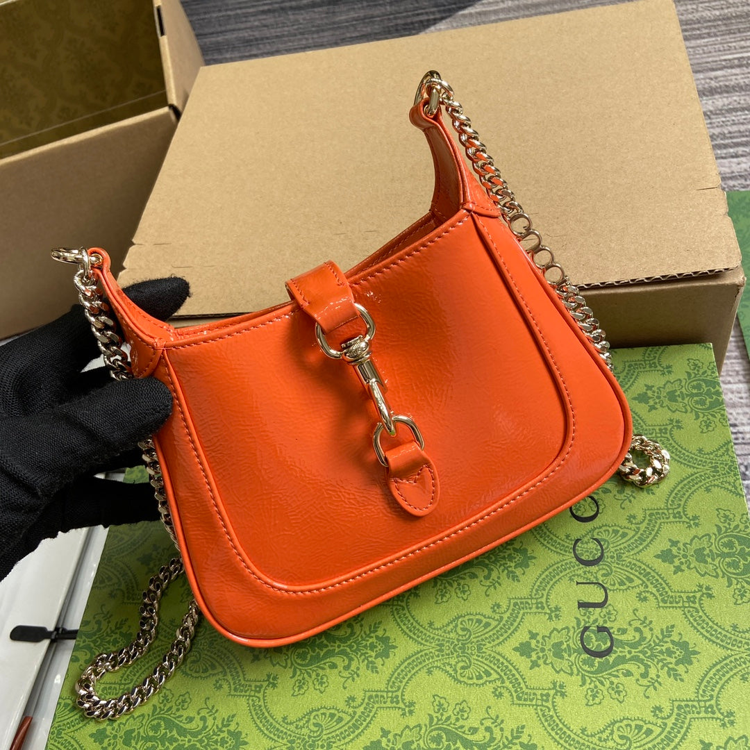 JACKIE NOTTE MINI BAG 19 IN ORANGE CRACKED LACQUER CALFSKIN GOLD HARDWARE