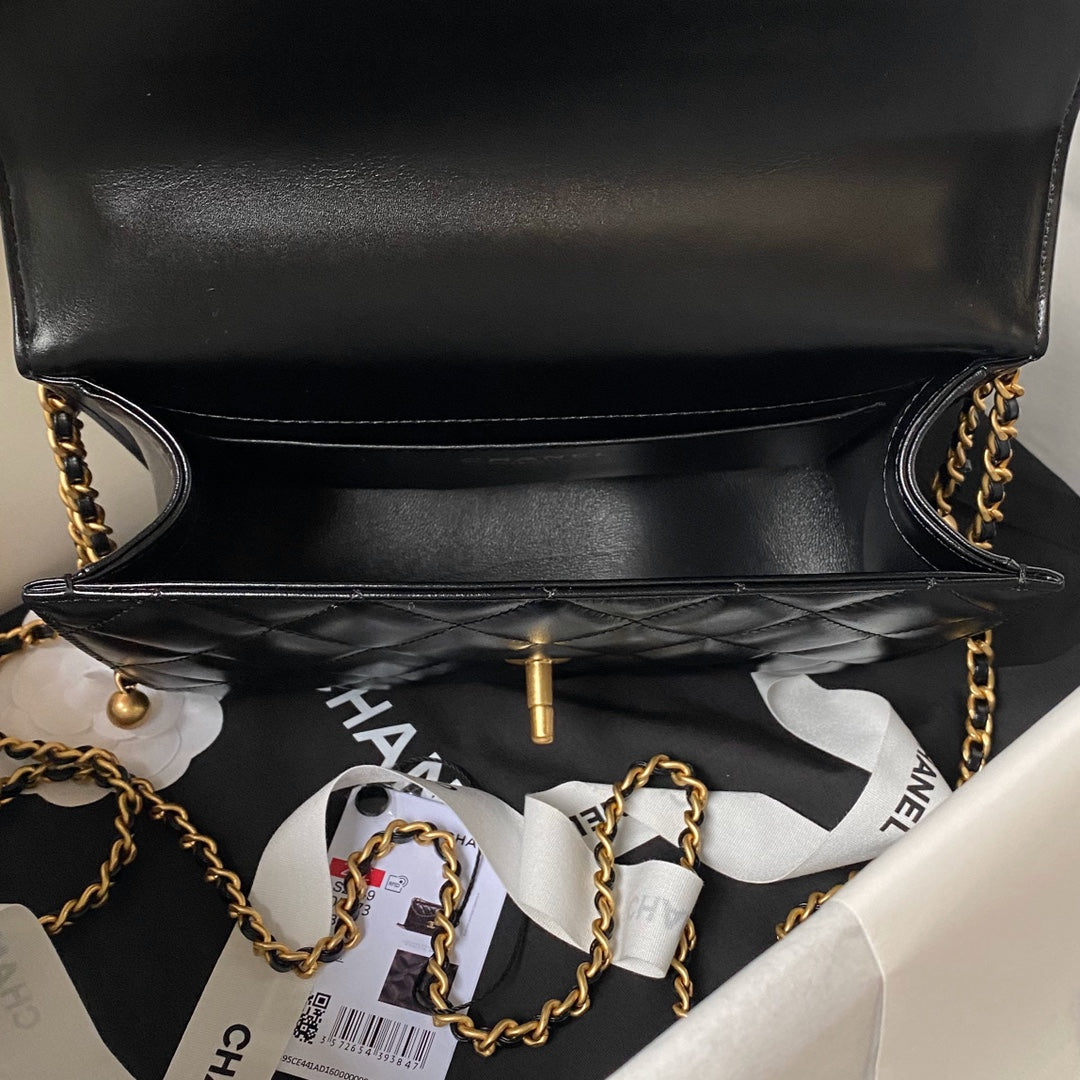 FLAP BAG 22 IN BLACK CALFSKIN WITH DOUBLE GOLD BALL