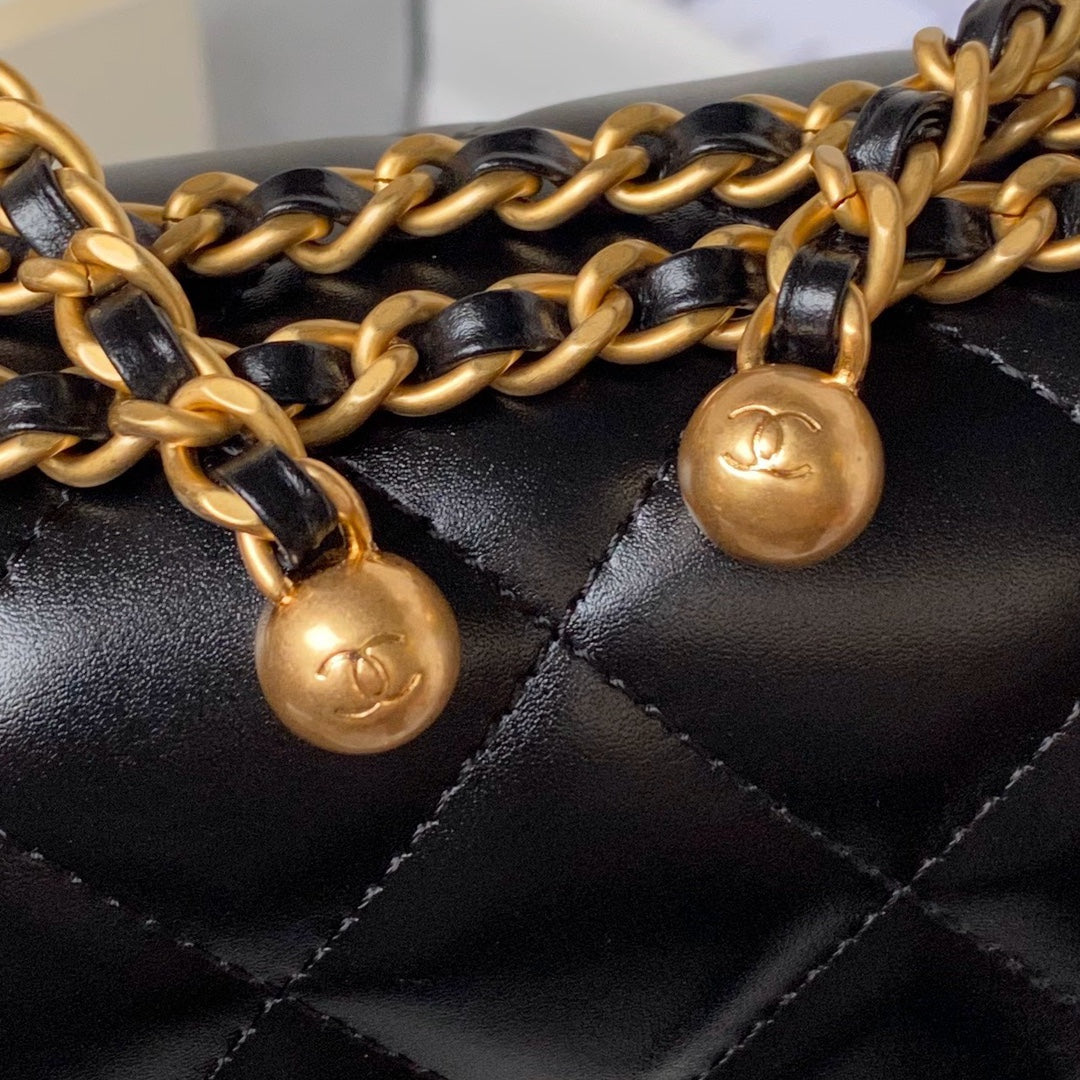 FLAP BAG 22 IN BLACK CALFSKIN WITH DOUBLE GOLD BALL