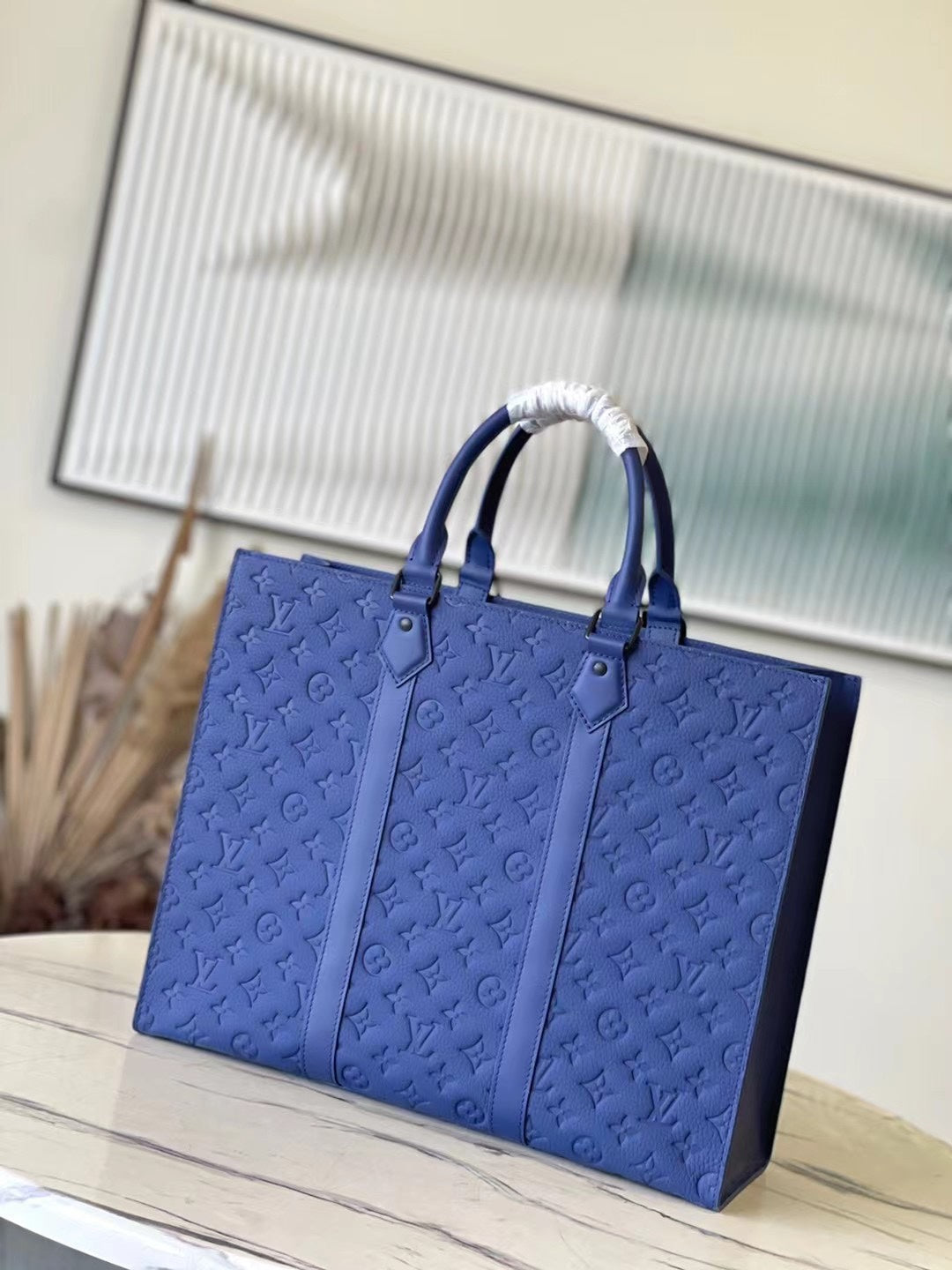 SAC PLAT 24H 41 IN SAPPHIRE BLUE MONOGRAM EMBOSSED TAURILLON