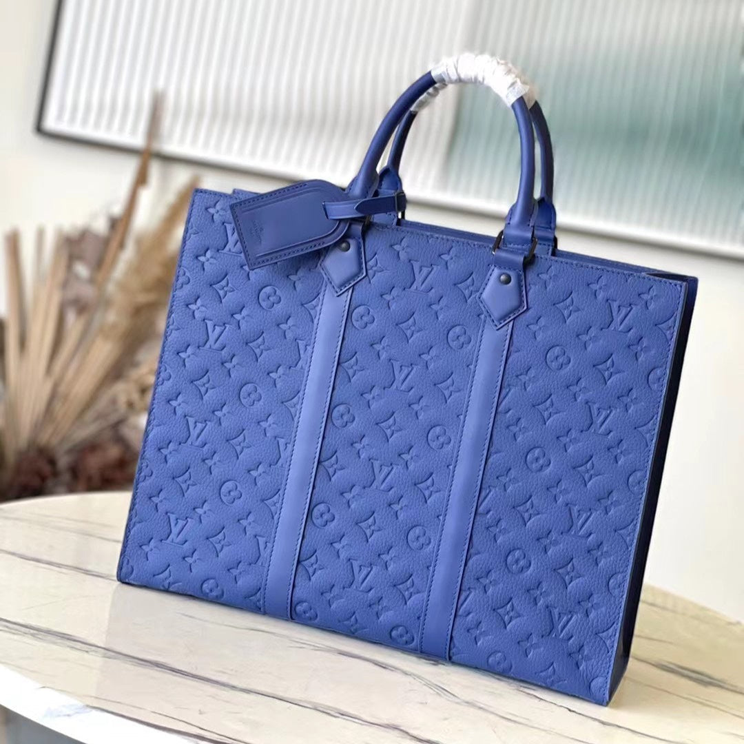 SAC PLAT 24H 41 IN SAPPHIRE BLUE MONOGRAM EMBOSSED TAURILLON