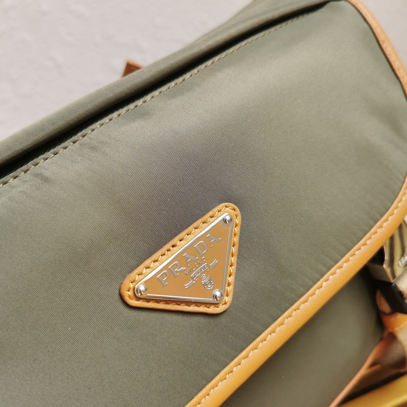 MESSENGER BAG 20 IN KHAKI GREEN RE-NYLON AND BROWN CALFSKIN TRIM