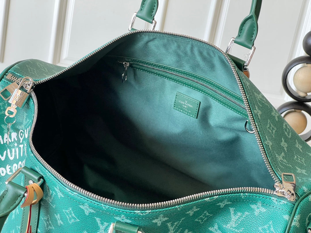 KEEPALL BANDOULIÈRE 50 IN GREEN MONOGRAM HERITAGE CANVAS