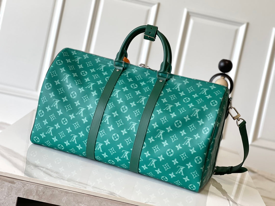 KEEPALL BANDOULIÈRE 50 IN GREEN MONOGRAM HERITAGE CANVAS