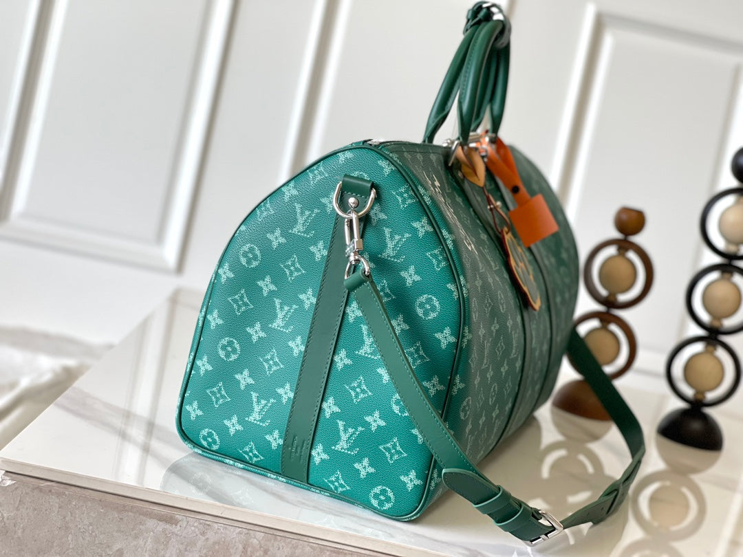 KEEPALL BANDOULIÈRE 50 IN GREEN MONOGRAM HERITAGE CANVAS