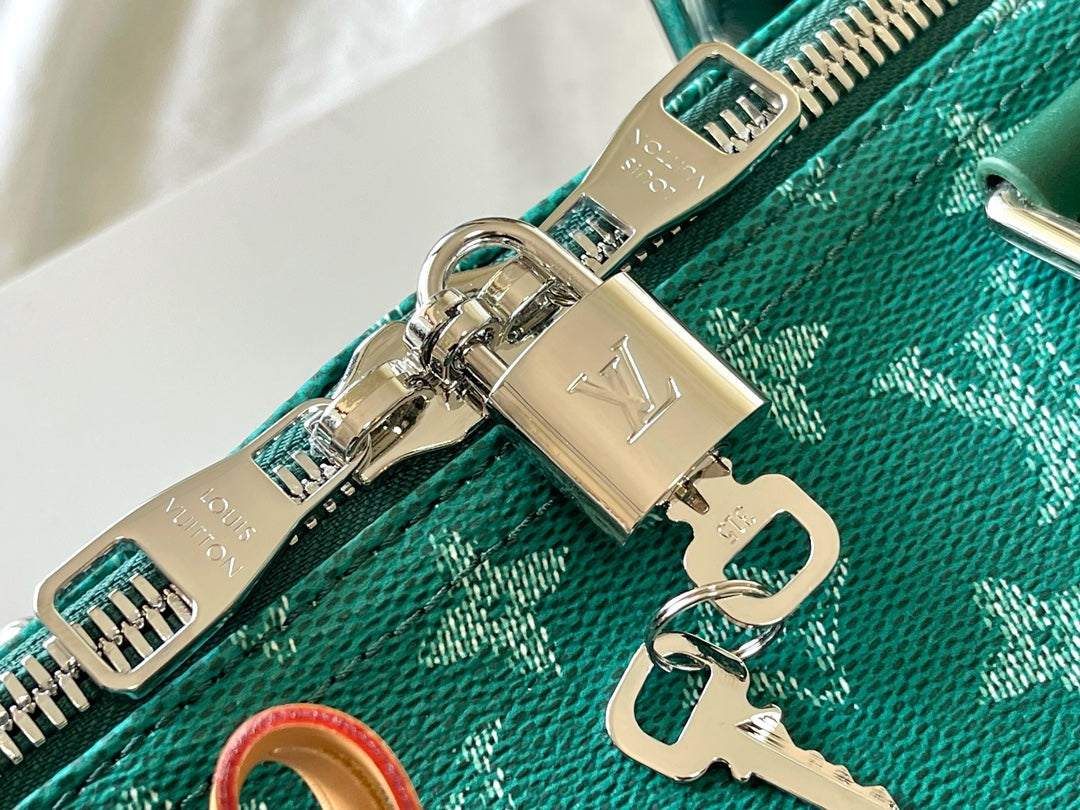 KEEPALL BANDOULIÈRE 50 IN GREEN MONOGRAM HERITAGE CANVAS