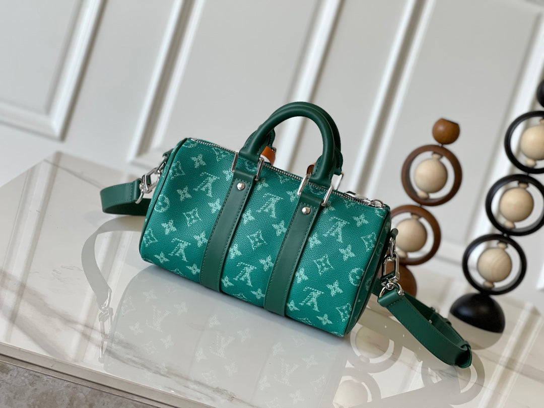 KEEPALL BANDOULIÈRE 25 IN GREEN MONOGRAM HERITAGE CANVAS