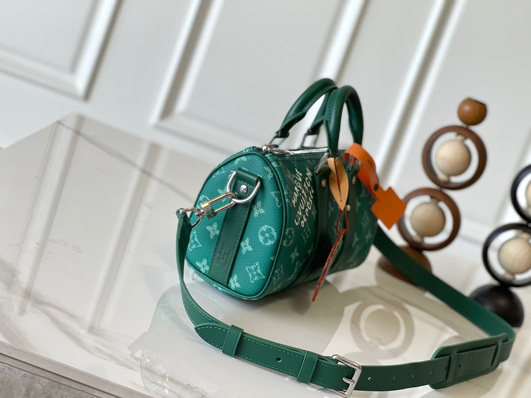 KEEPALL BANDOULIÈRE 25 IN GREEN MONOGRAM HERITAGE CANVAS