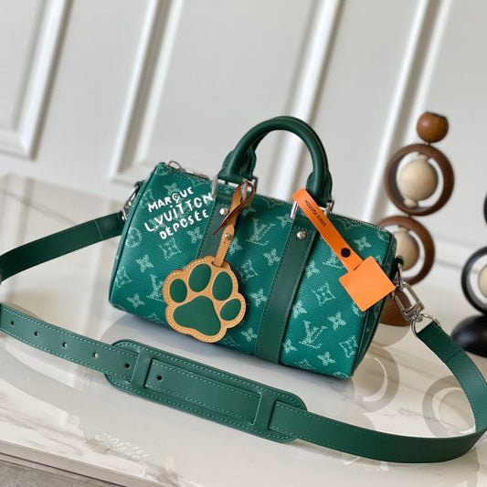 KEEPALL BANDOULIÈRE 25 IN GREEN MONOGRAM HERITAGE CANVAS