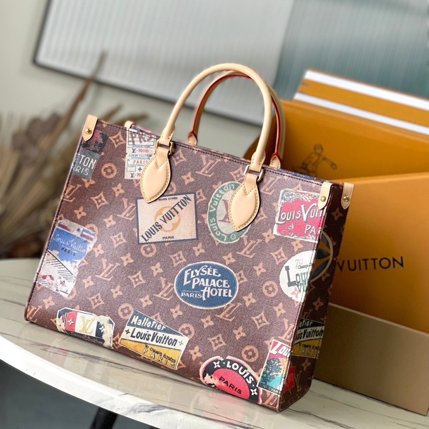 ONTHEGO VOYAGE 35 IN BROWN MONOGRAM CANVAS WITH VINTAGE HOTEL LABELS