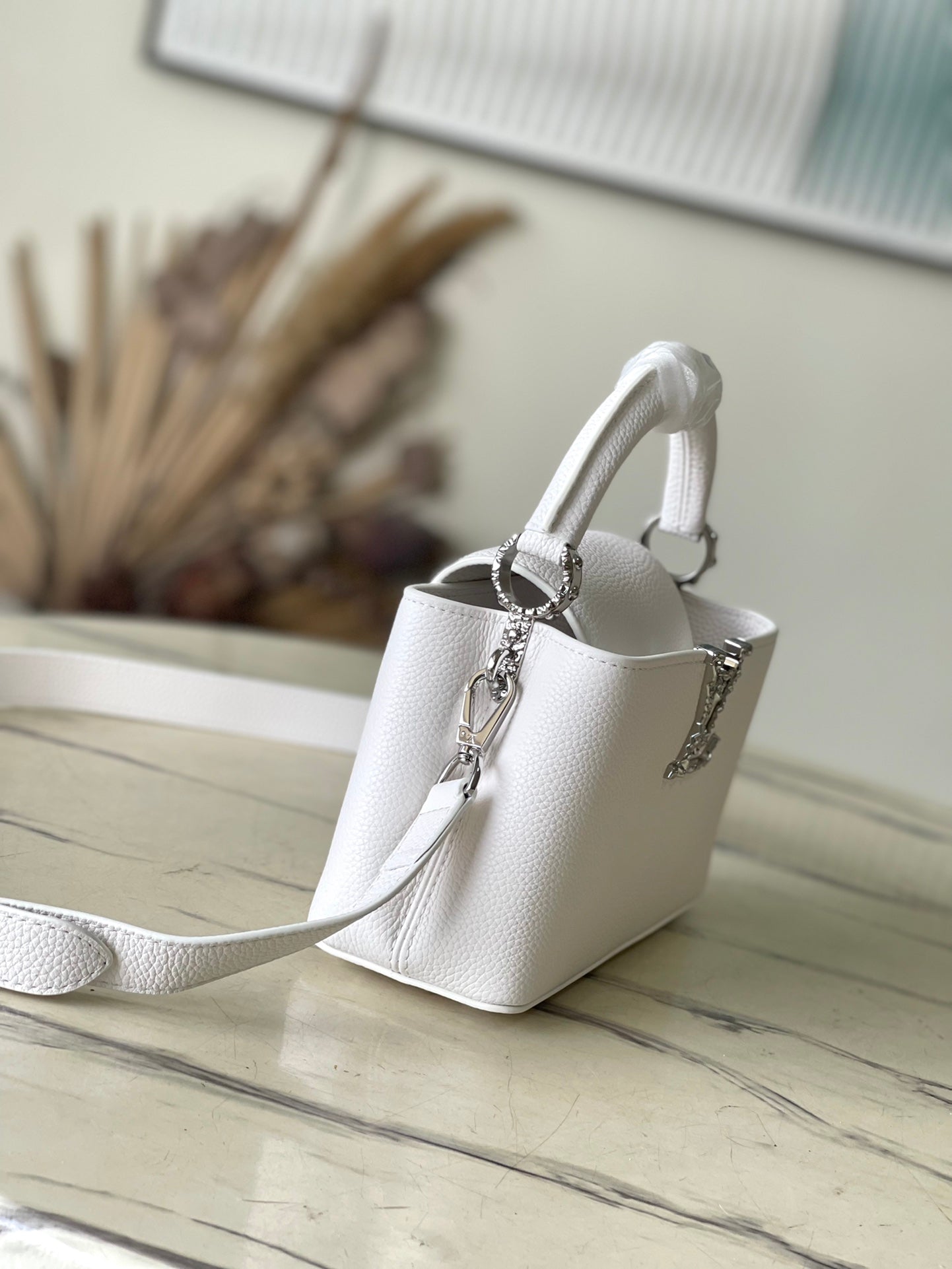 CAPUCINES EAST-WEST MINI 22 IN WHITE CALFSKIN SILVER HARDWARE