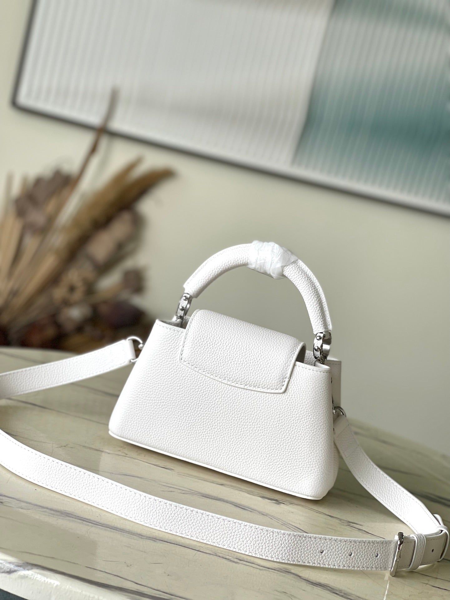 CAPUCINES EAST-WEST MINI 22 IN WHITE CALFSKIN SILVER HARDWARE