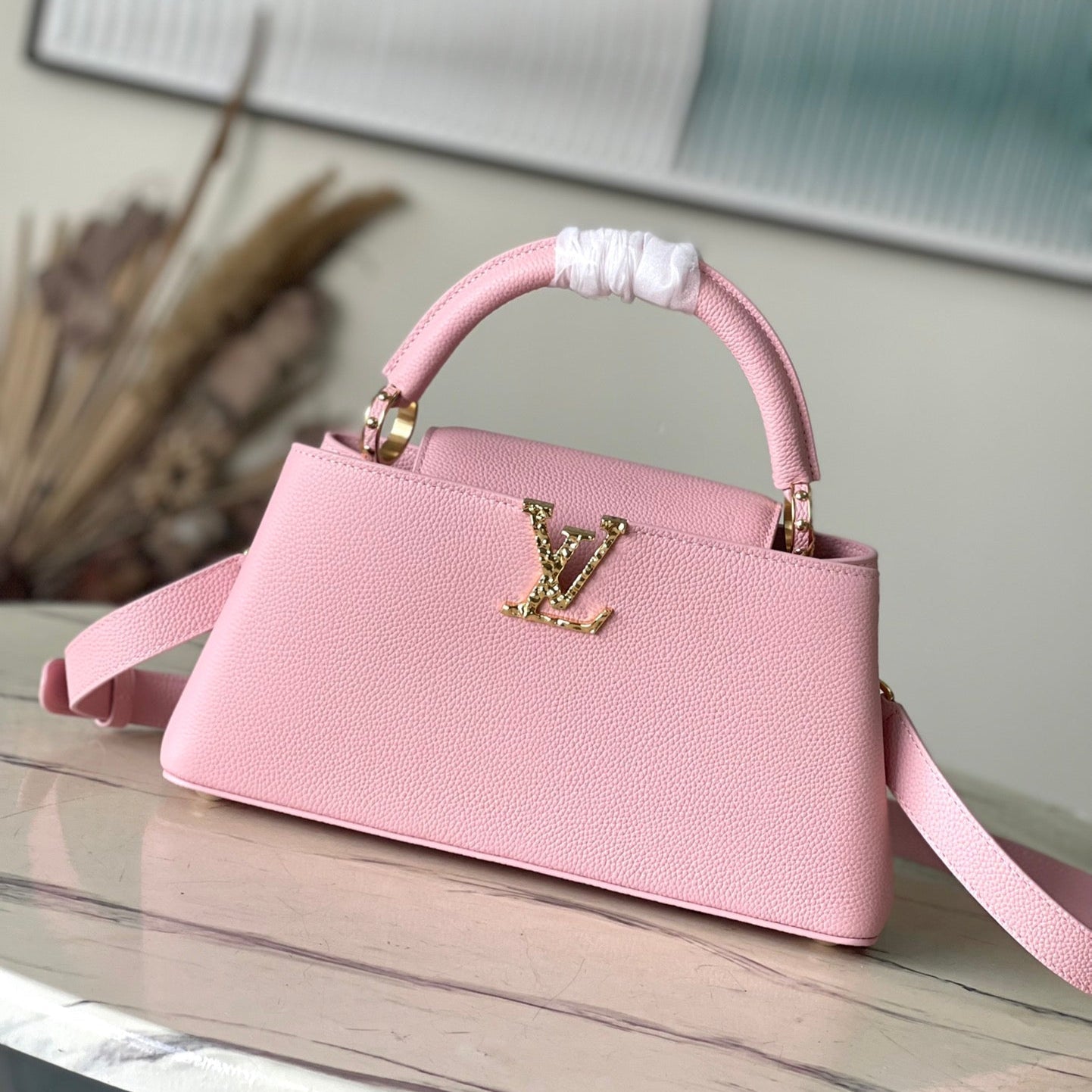 CAPUCINES EAST-WEST 33 IN BLUSH PINK CALFSKIN GOLD HARDWARE