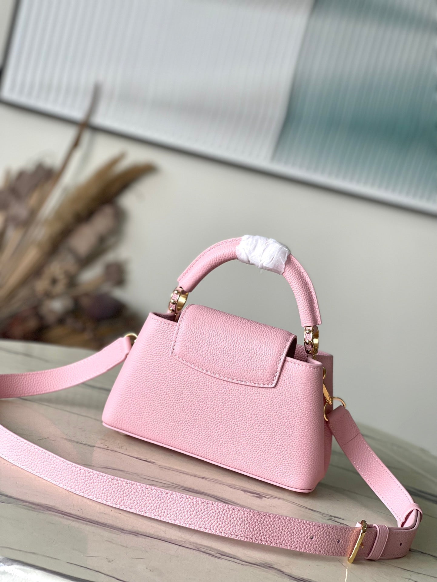 CAPUCINES EAST-WEST MINI 22 IN BLUSH PINK CALFSKIN GOLD HARDWARE