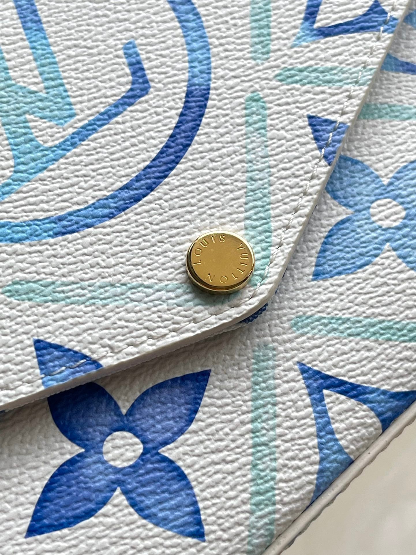 FÉLICIE POCHETTE 21 IN LAGOON BLUE MONOGRAM TILES CANVAS