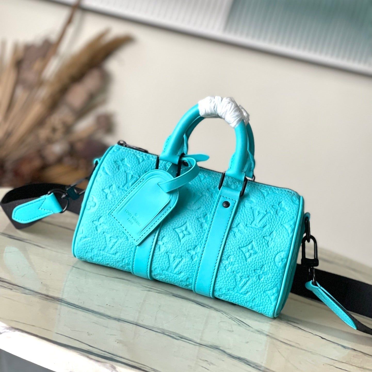 KEEPALL BANDOULIÈRE 25 IN TURQUOISE BLUE MONOGRAM EMBOSSED CALFSKIN