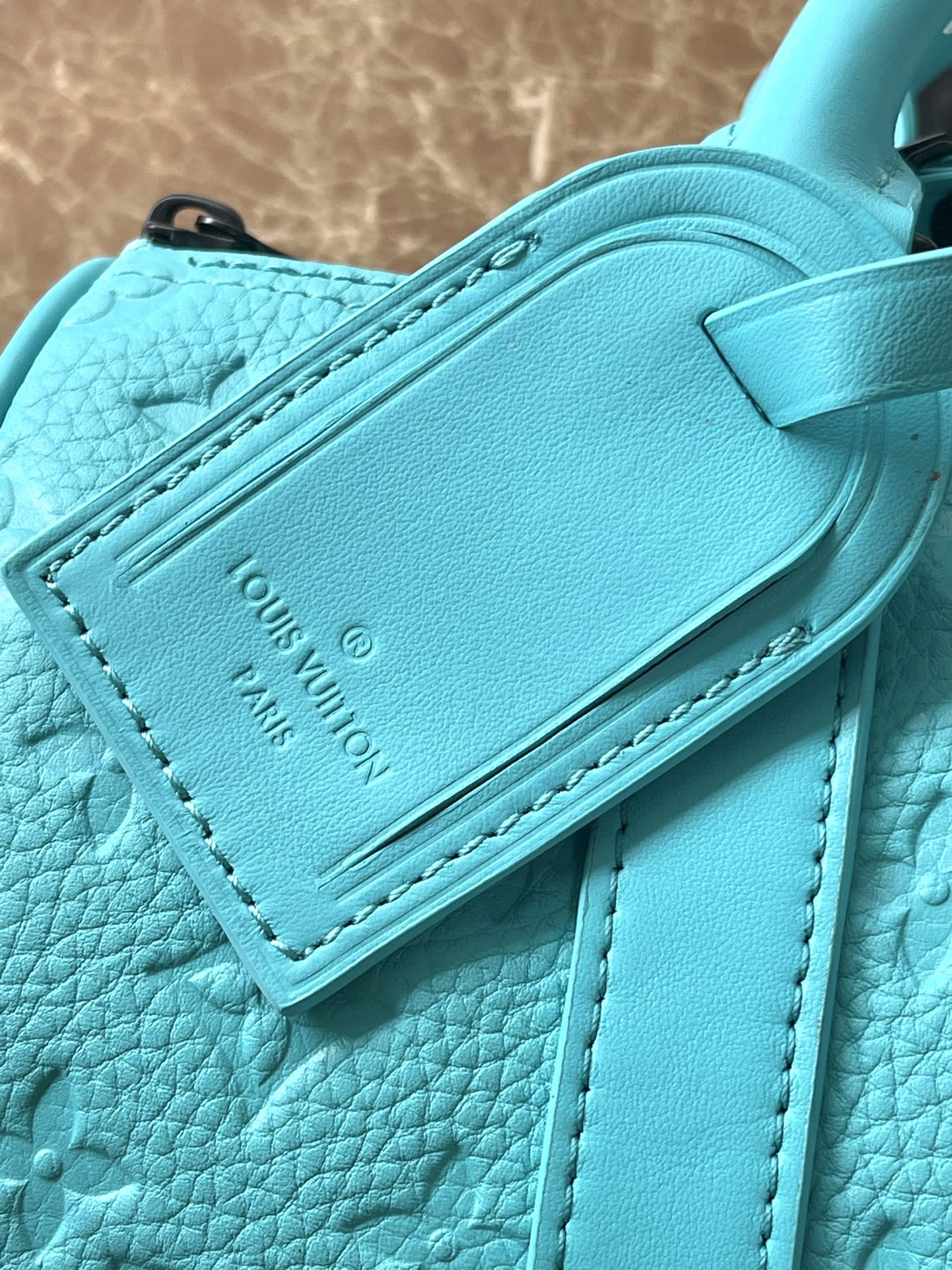 KEEPALL BANDOULIÈRE 25 IN TURQUOISE BLUE MONOGRAM EMBOSSED CALFSKIN