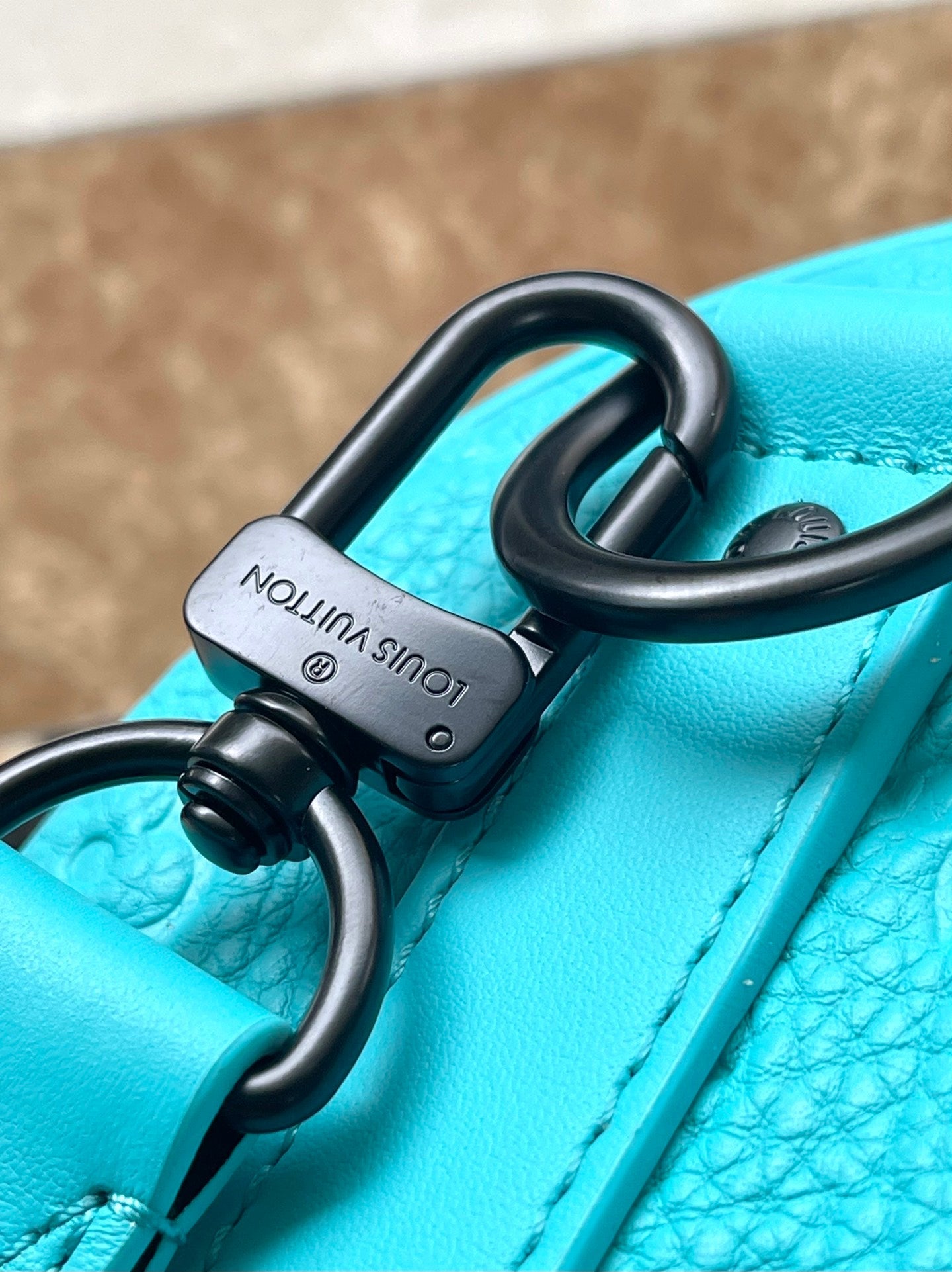 KEEPALL BANDOULIÈRE 25 IN TURQUOISE BLUE MONOGRAM EMBOSSED CALFSKIN