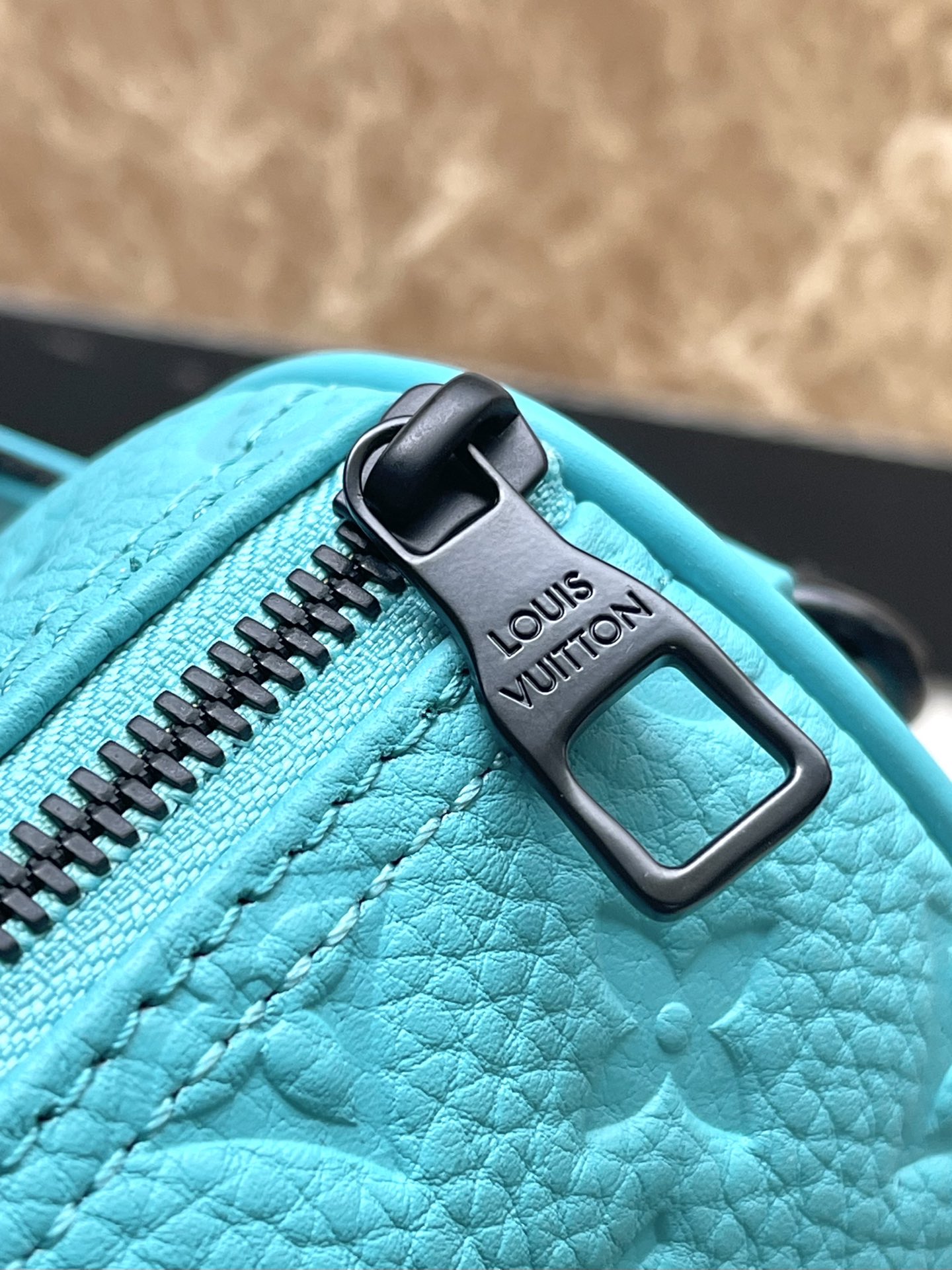 KEEPALL BANDOULIÈRE 25 IN TURQUOISE BLUE MONOGRAM EMBOSSED CALFSKIN