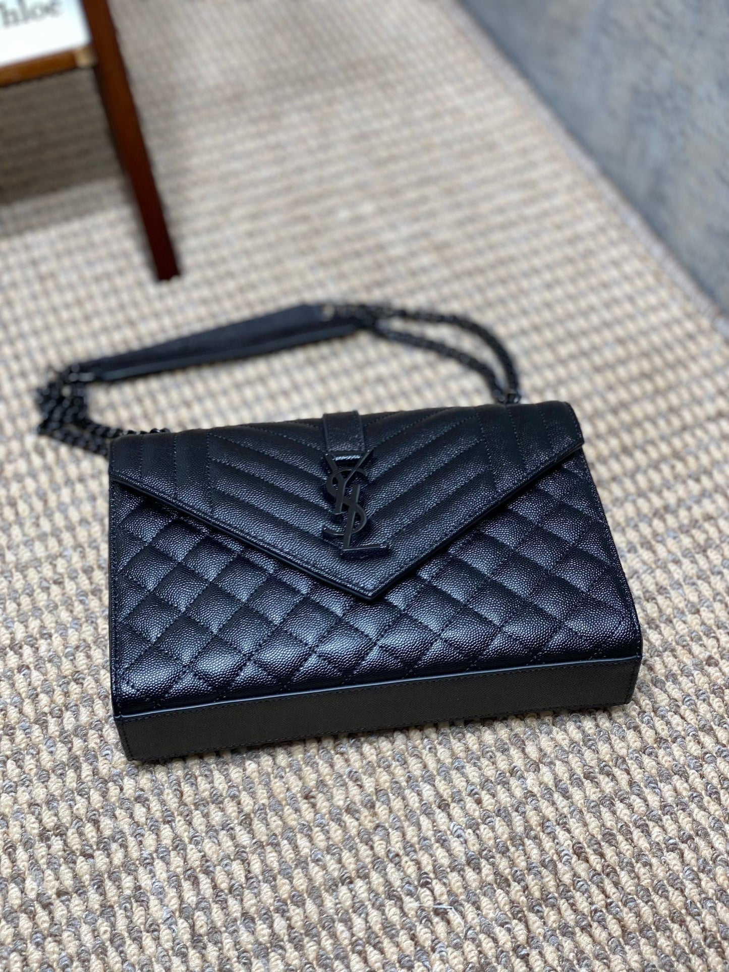 ENVELOPE CHAIN BAG 24 IN BLACK CALFSKIN