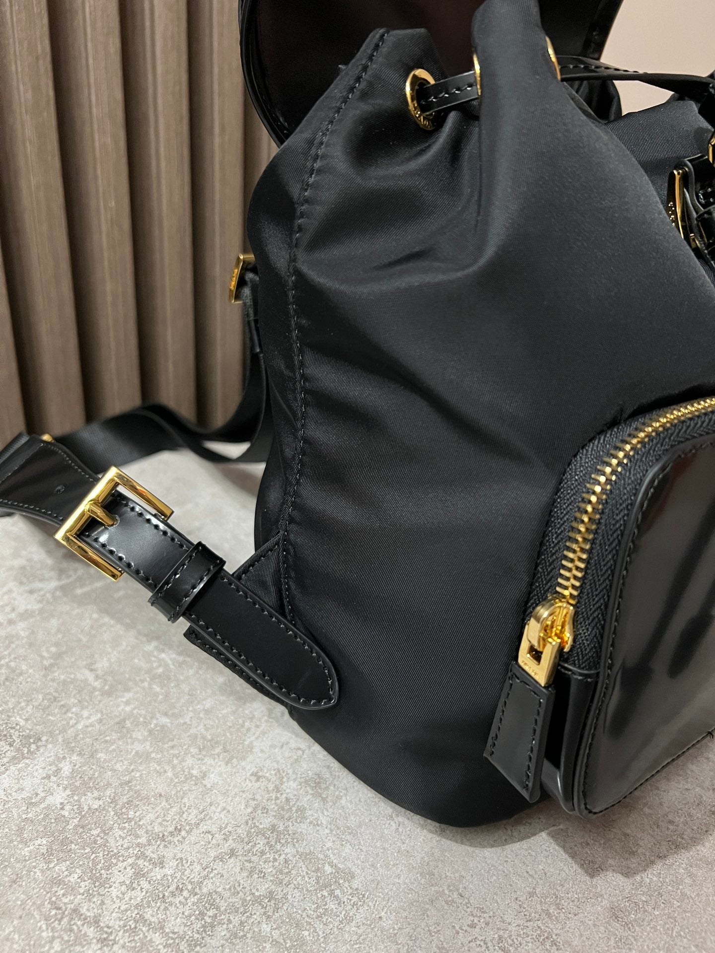 BACKPACK 25 IN BLACK RE-NYLON AND GLOSSY CALFSKIN GOLD HARDWARE