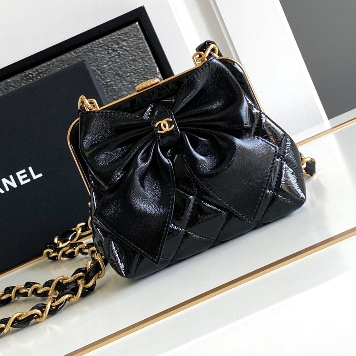 CC MINI 13 CLUTCH WITH STRAP IN BLACK LAMBSKIN ATTACH BOW