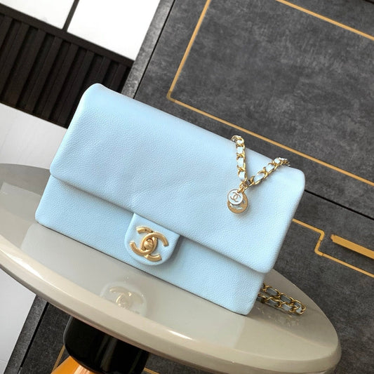 CLASSIC FLAP BAG 22 IN SKY BLUE CALFSKIN GOLD HARDWARE