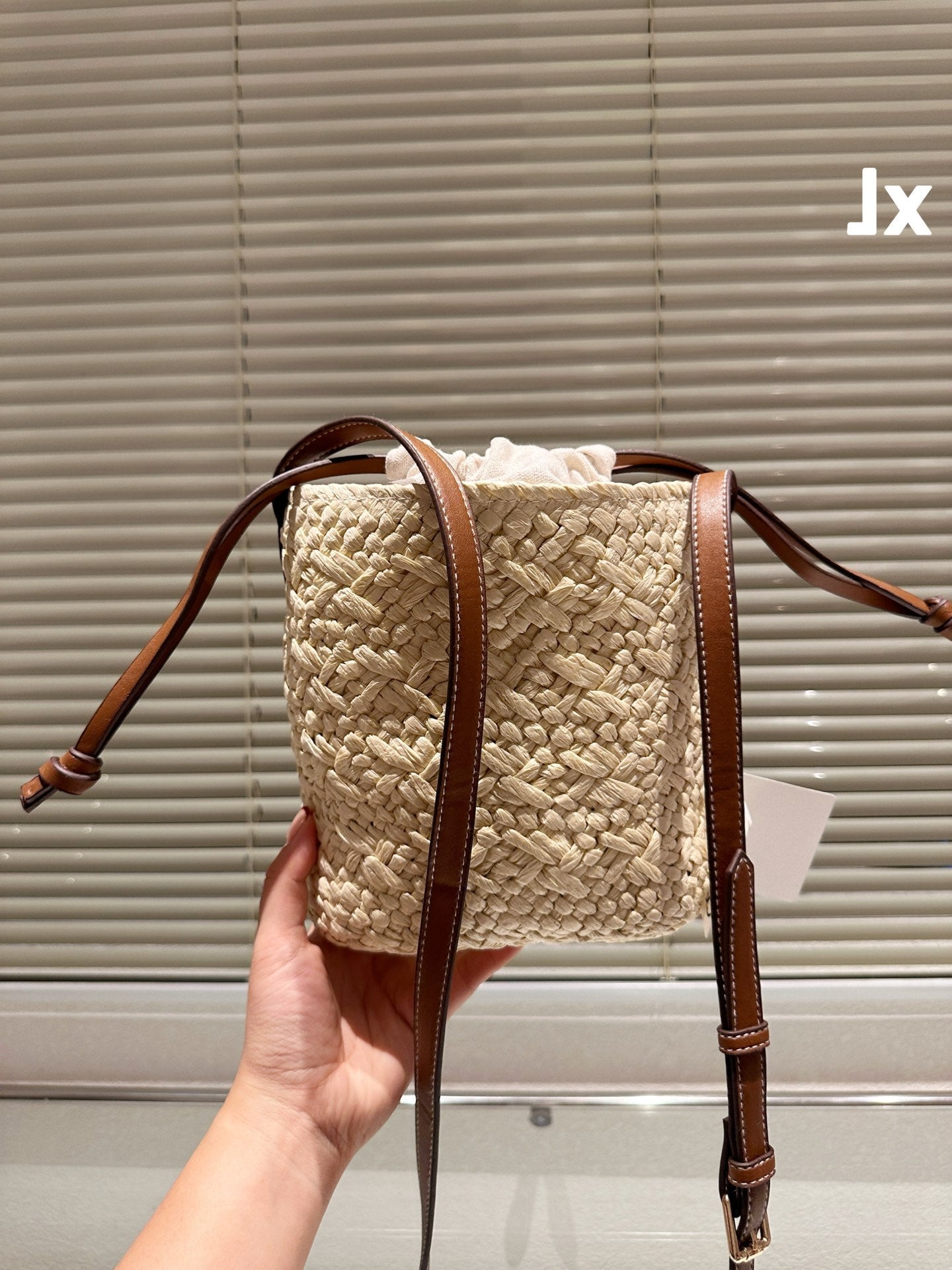 LOE ANAGRAM MINI 18 BUCKET BAG IN NATURAL RAFFIA