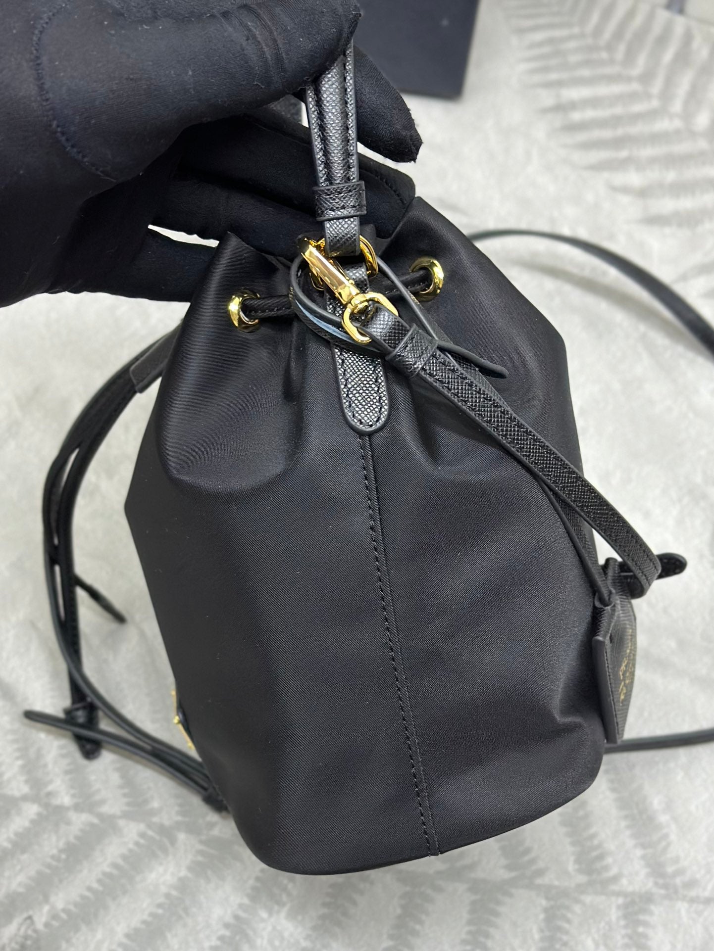 BUCKET BAG 19 IN BLACK RE-NYLON AND CALFSKIN HANDLE