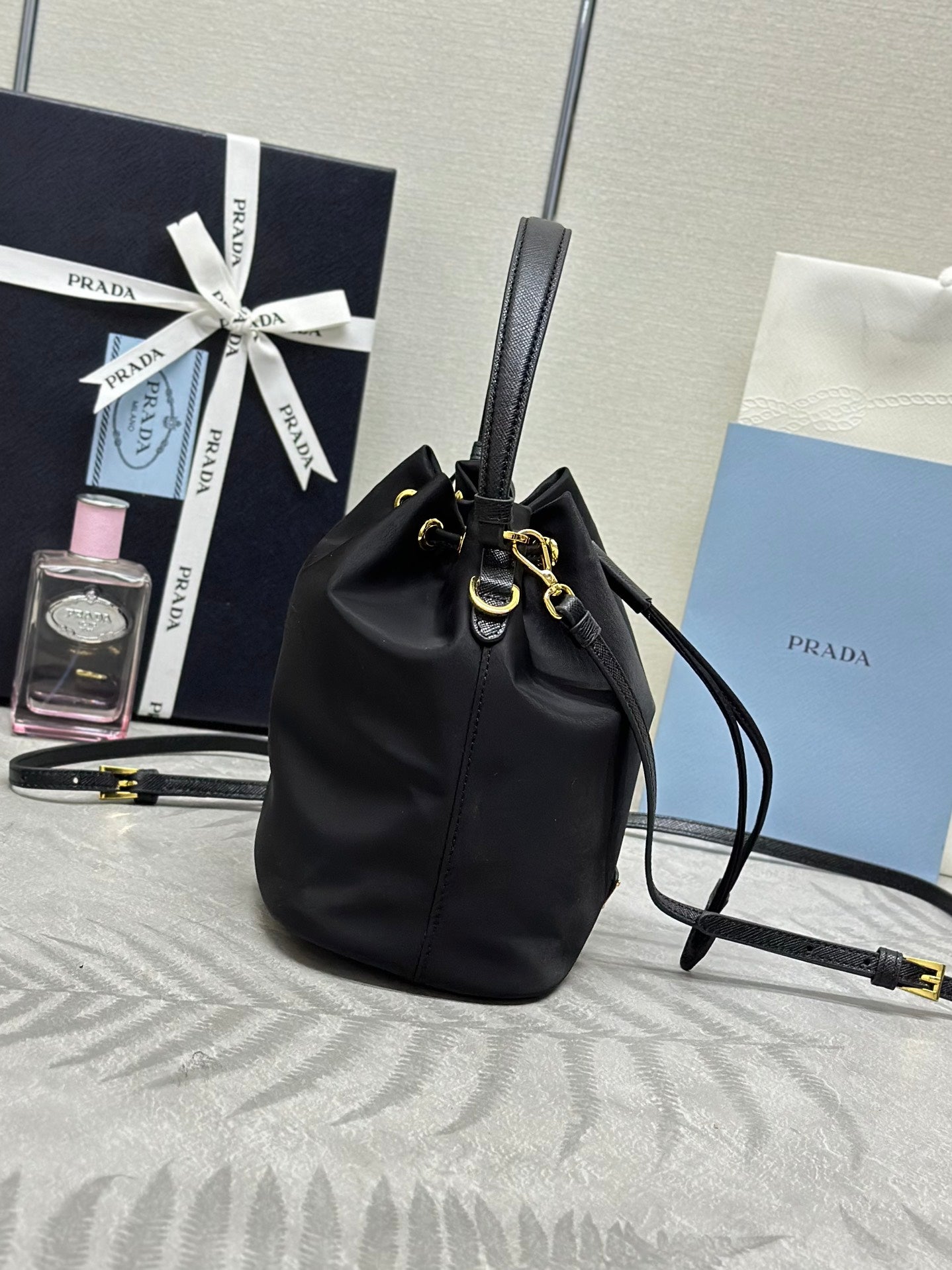 BUCKET BAG 19 IN BLACK RE-NYLON AND CALFSKIN HANDLE