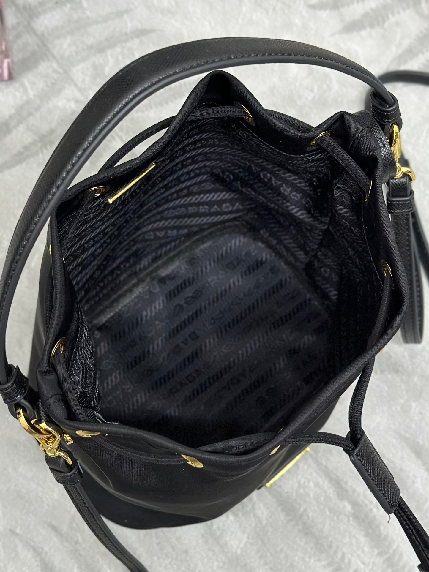 BUCKET BAG 19 IN BLACK RE-NYLON AND CALFSKIN HANDLE