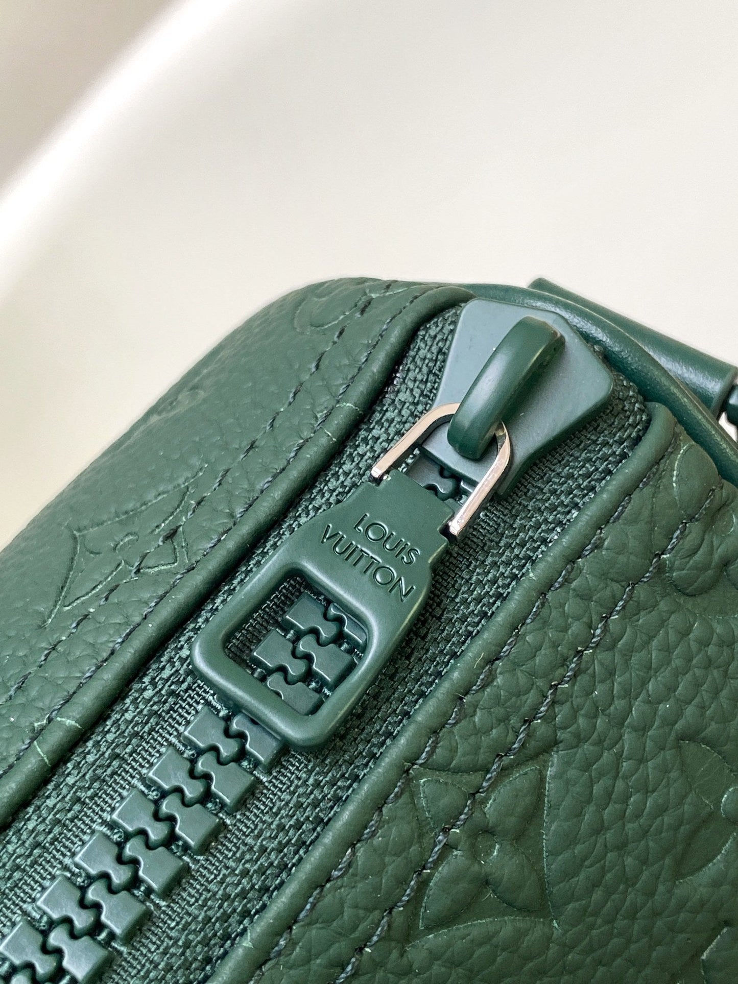 KEEPALL BANDOULIÈRE 25 IN FOREST GREEN MONOGRAM EMBOSSED CALFSKIN