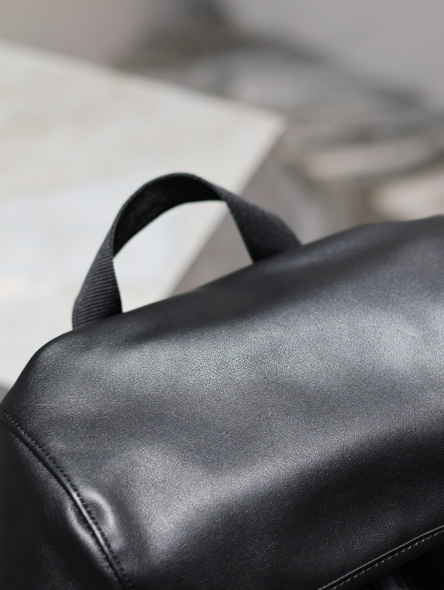 BACKPACK 45 IN BLACK CALFSKIN WITH EMBOSSED LOGO