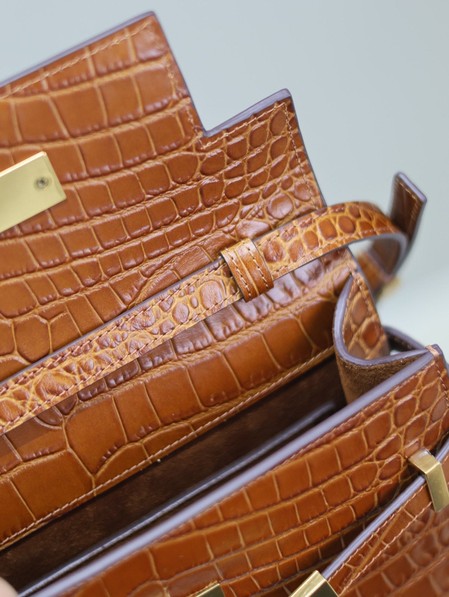 MANHATTAN SMALL 24 IN BROWN CROCODILE PATTERN CALFSKIN GOLD BUCKLE