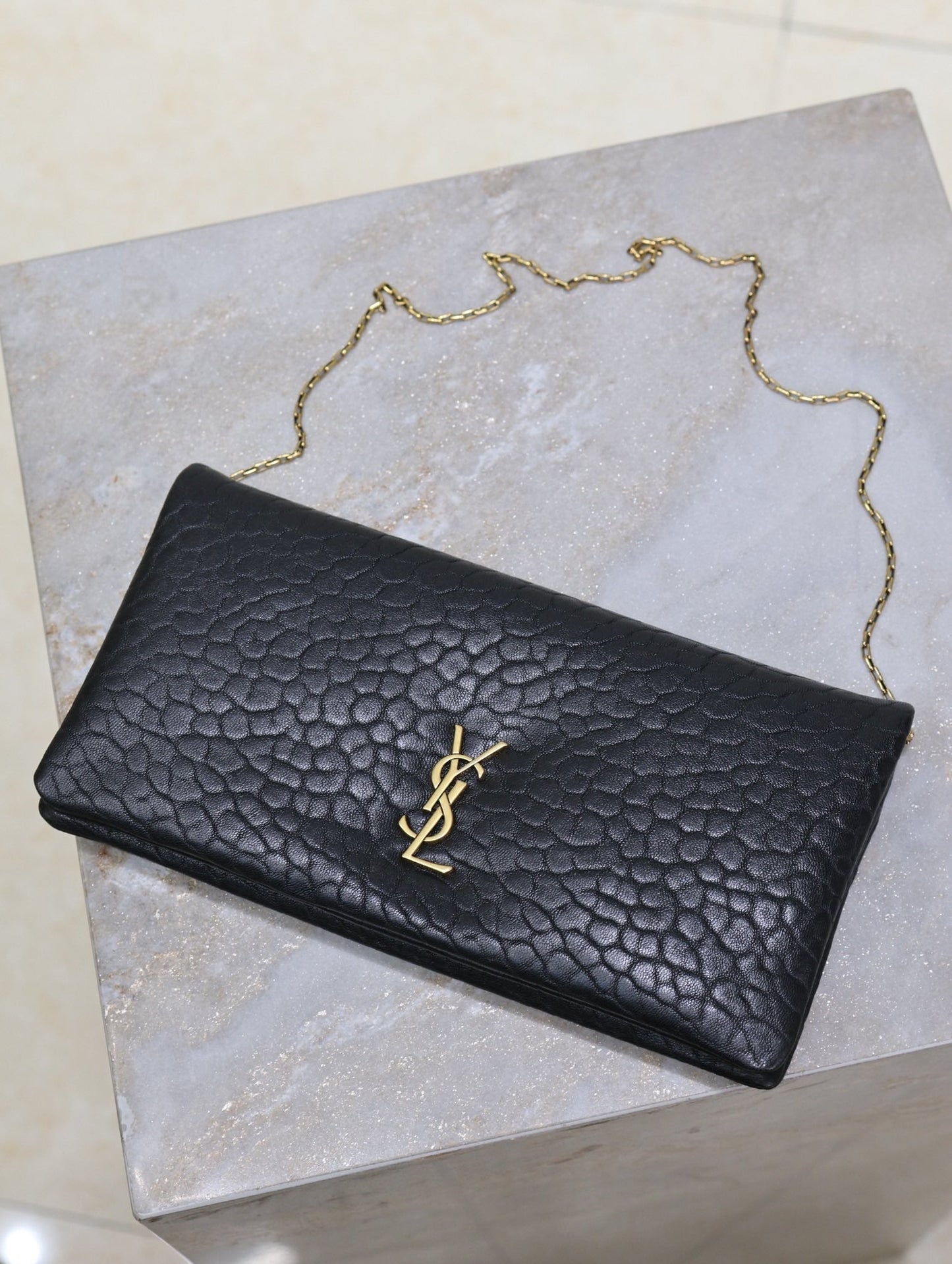 CALYPSO POUCH 24 IN BLACK ELEPHANT TEXTURED LAMBSKIN GOLD LOGO