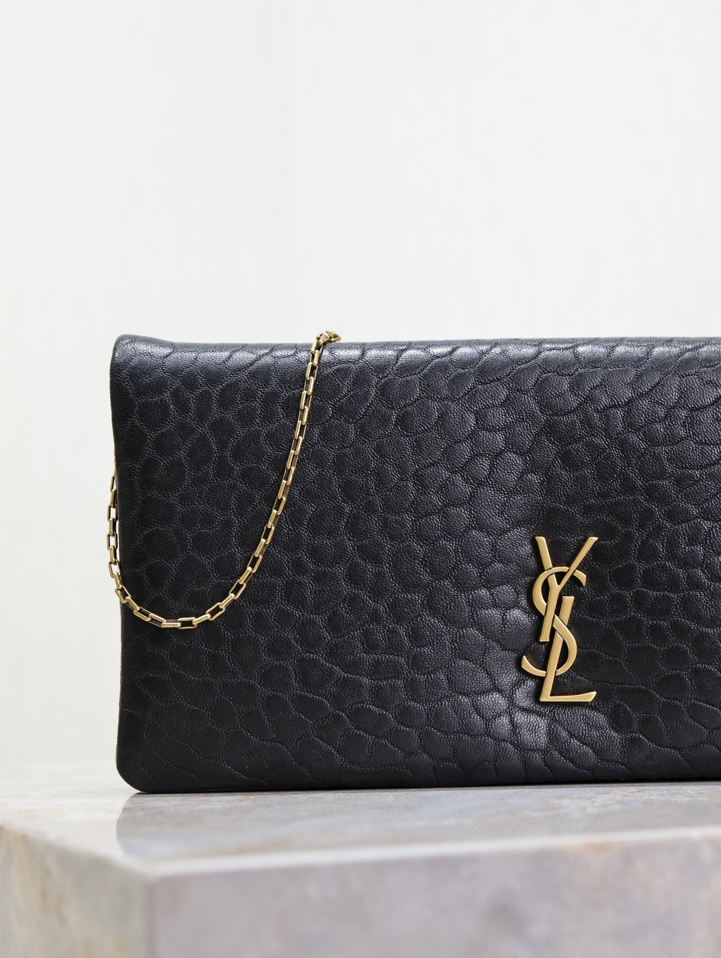 CALYPSO POUCH 24 IN BLACK ELEPHANT TEXTURED LAMBSKIN GOLD LOGO