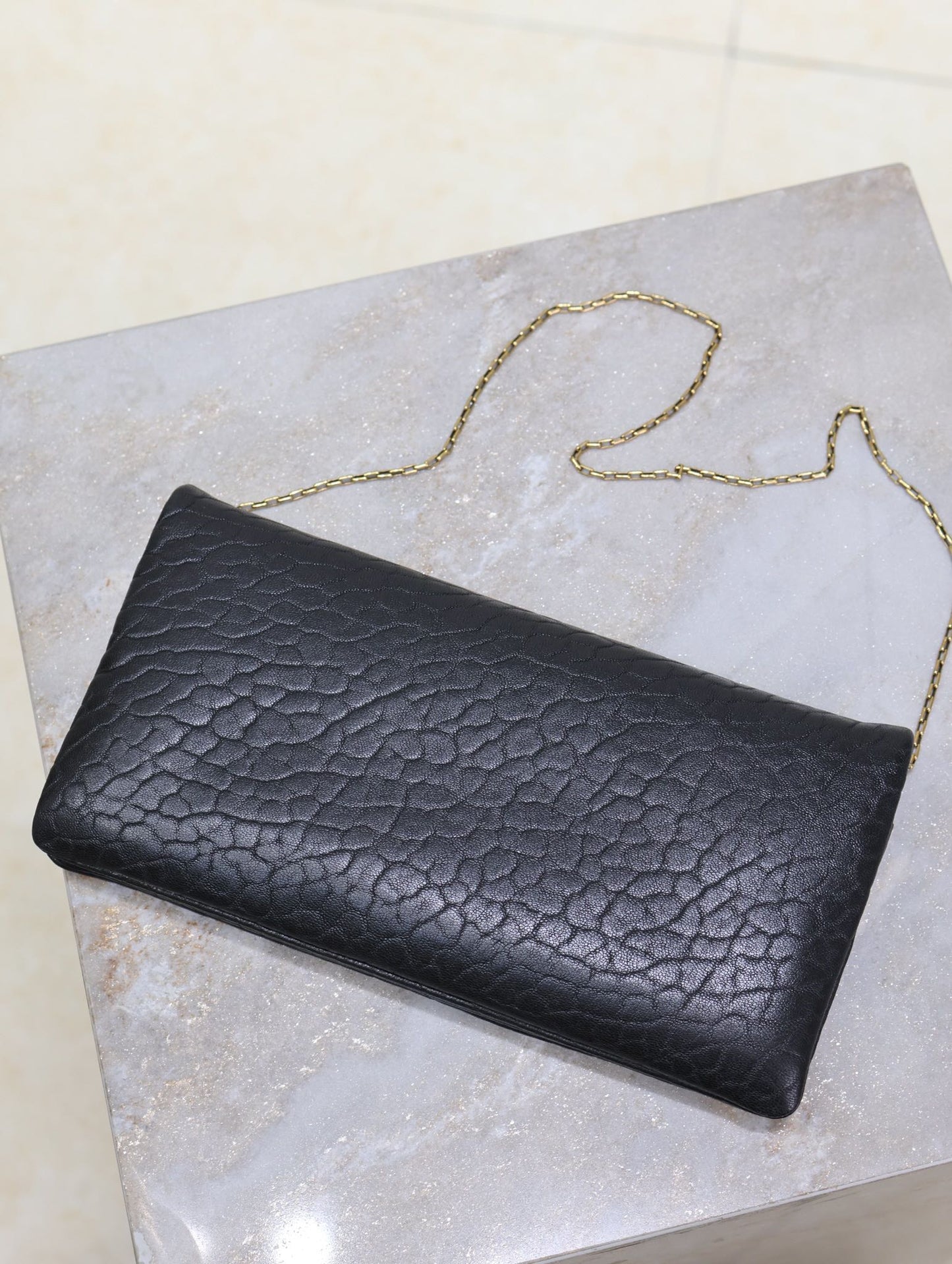 CALYPSO POUCH 24 IN BLACK ELEPHANT TEXTURED LAMBSKIN GOLD LOGO