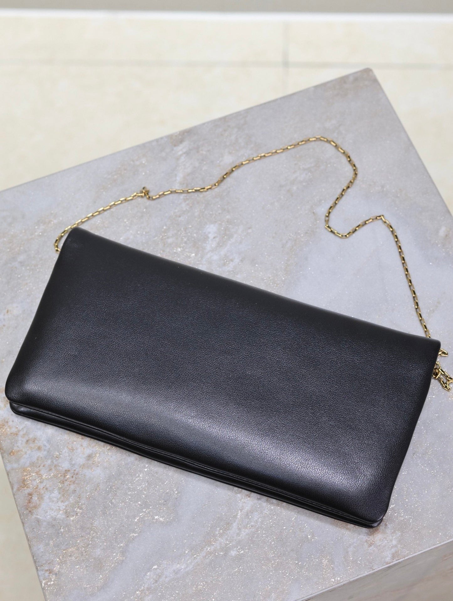 CALYPSO POUCH 24 IN BLACK LAMBSKIN GOLD LOGO