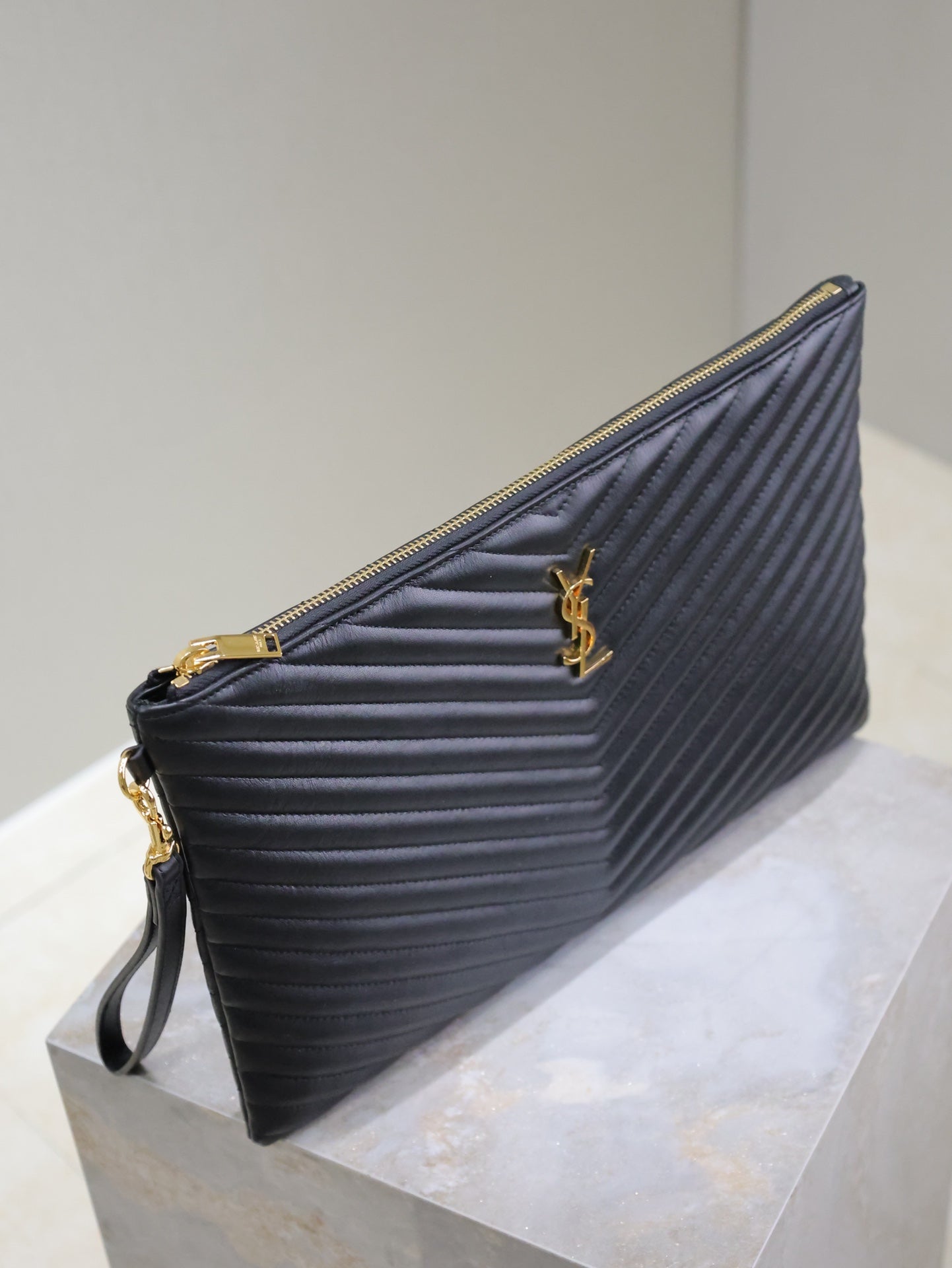 CLUTCH 36 IN BLACK QUILTED CALFSKIN GOLD BUCKLE