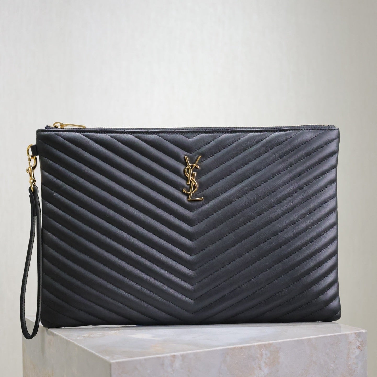 CLUTCH 36 IN BLACK QUILTED CALFSKIN GOLD BUCKLE