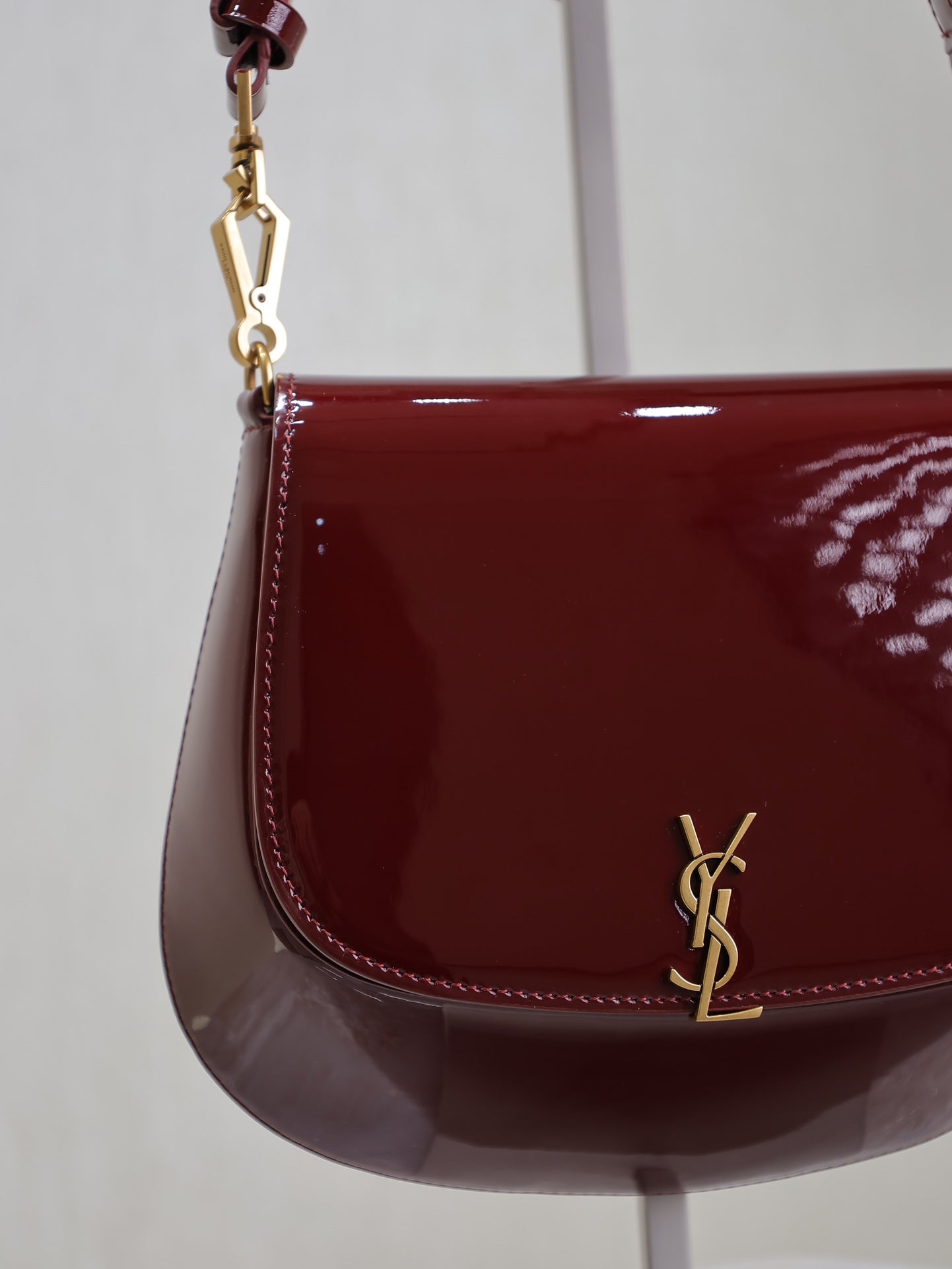 VOLTAIRE SADDLE BAG 21 IN BORDEAUX RED PATENT CALFSKIN